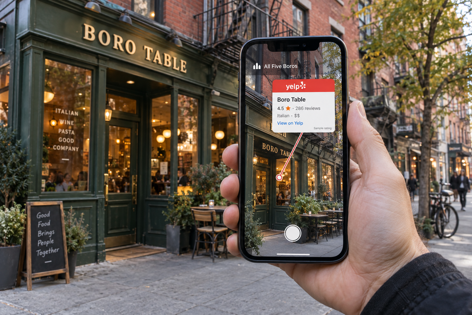 A hand holds an iPhone in front of a New York restaurant; the phone shows the same storefront with a Yelp-branded review card connected to its entrance.